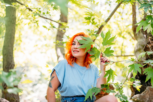 Beautiful Redhead Woman in the Untouched Forest and River