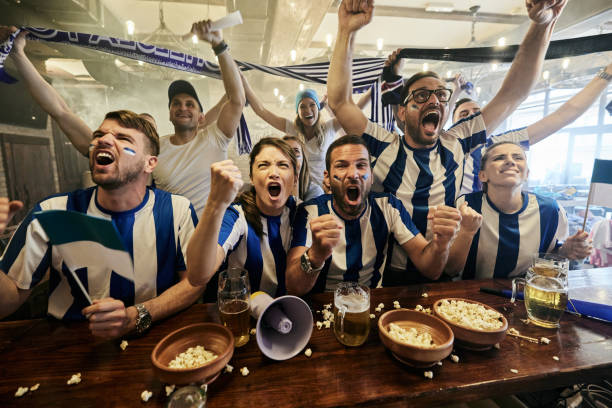 istock Cheering for favorite sports team in a bar! 1399140932