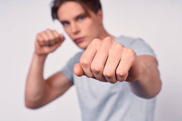 istock A young sports guy with a punch forward. 1399141454