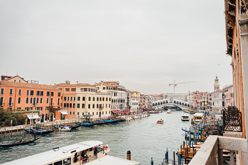 Panoramic view of famous Venetian Grand Canal and Rialto bridge on a cloudy winter day