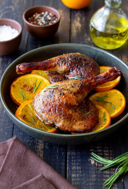 istock Baked duck legs with oranges and rosemary. Rustic style. 1399142195