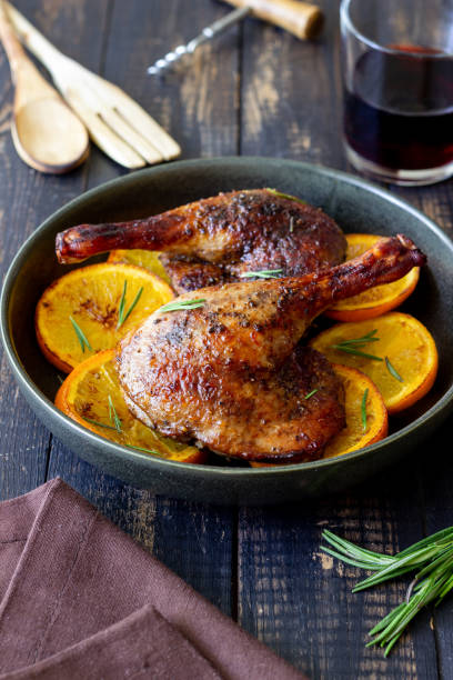 istock Baked duck legs with oranges and rosemary. Rustic style. 1399142203