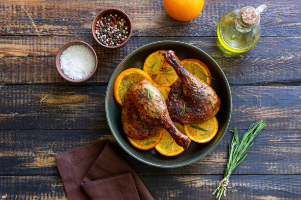 istock Baked duck legs with oranges and rosemary. Rustic style. 1399142225