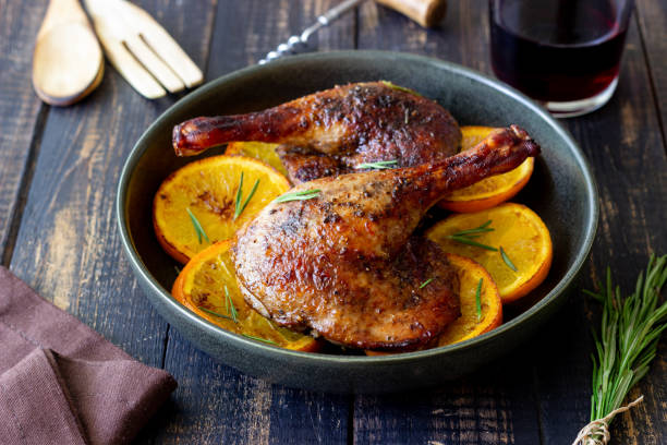 istock Baked duck legs with oranges and rosemary. Rustic style. 1399142967