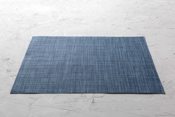 istock Perspective view of grey tablecloth for food on cement background. Empty space for your design 1399143115
