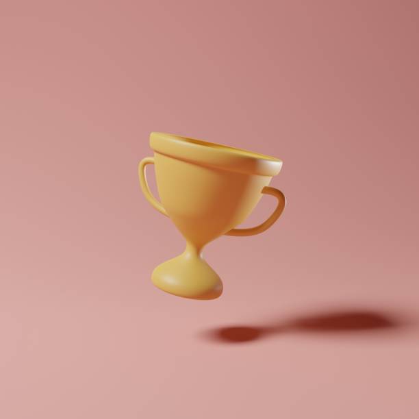 istock 3D rendering gold trophy cup on pastel pink background 1399149934