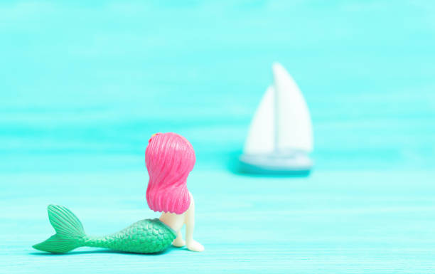 istock Mermaid figuring watching the passing sailboat 1399149975