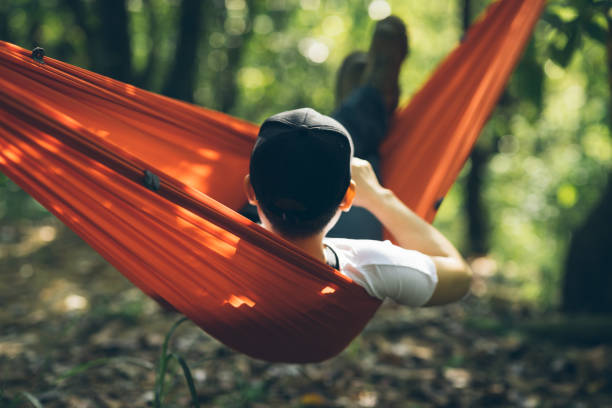 istock Relaxing in hammock in tropical forest 1399150300