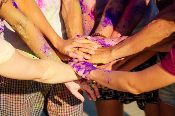 istock multinational multicultural mixed race friends in holi dust on beach in Goa 1399151211