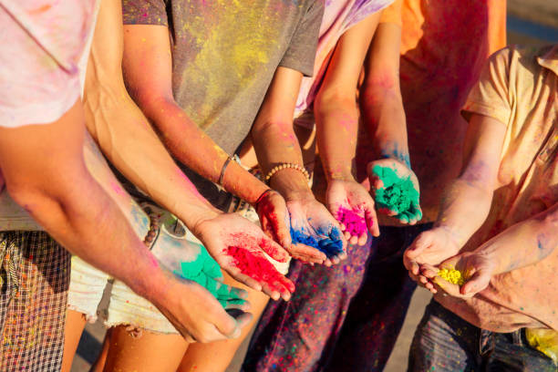 istock multinational multicultural mixed race friends in holi dust on beach in Goa 1399151230