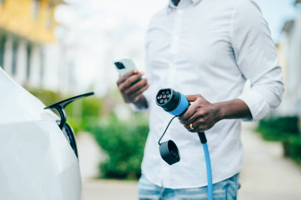 istock Man charging electric car 1399151399
