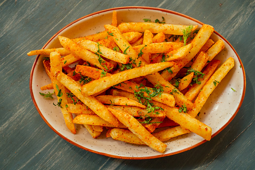 Heap of French fries on a plate