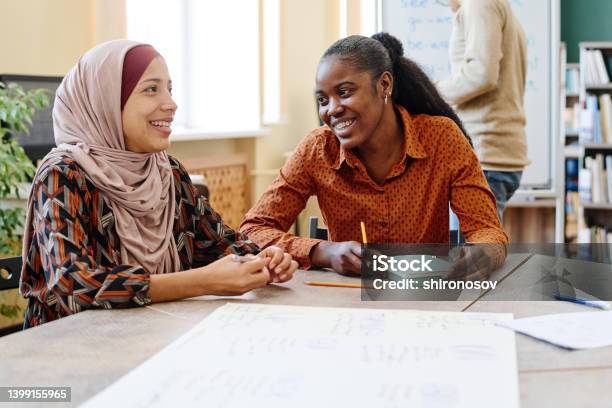 Joyful Women During Lesson Stock Photo - Download Image Now - Refugee, Immigrant, Community