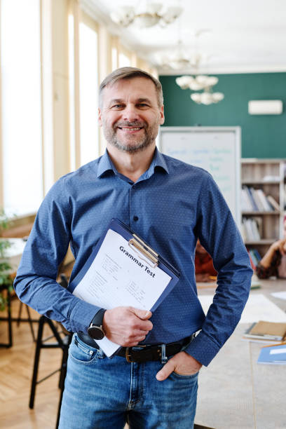 istock Cheerful Male Teacher Portrait 1399156274