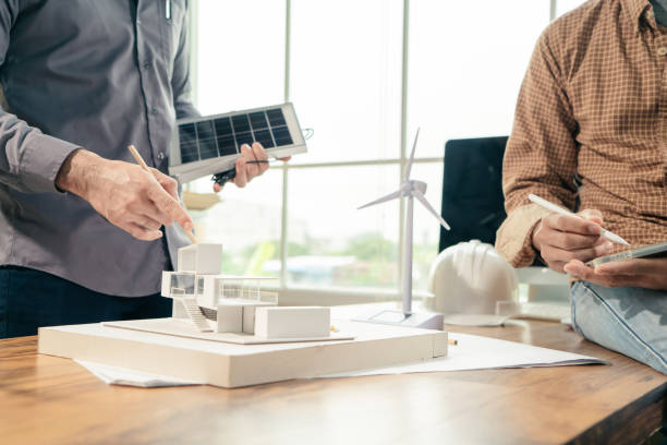 istock Team Architect brainstorm working design architecture with apply Renewable energy. 1399156772