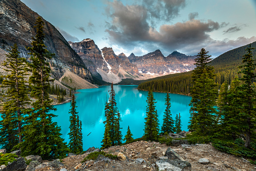 Moraine Lake in the Valley of the Ten Peaks in Banff National Park in Canada. Beautiful reflection of the Wenkchemna Peaks in the turquoise water of the lake. Canadian Rocky Mountains in Alberta, Canada.