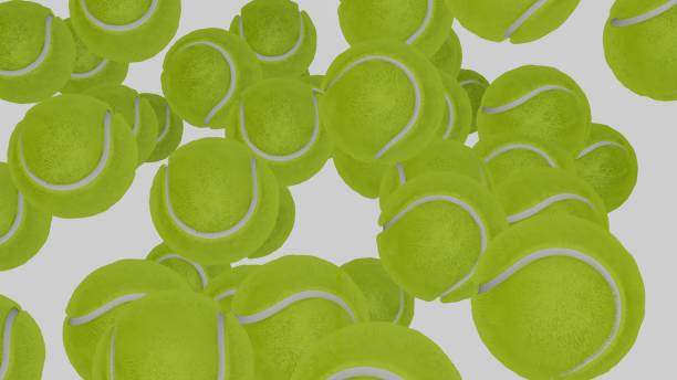 istock Many tennis balls falling down on white background. 1399158970
