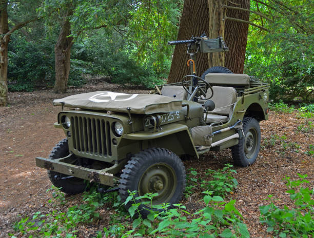 Silsoe, Bedfordshire, England - May 28, 2017:  Second World War  Jeep with machine Gun parked in woods.