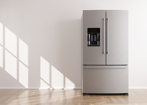 Refrigerator standing in empty room. Free, copy space for text or other objects. Household electrical equipment. Modern kitchen appliance. Stainless steel fridge with double doors, freezer. 3d render