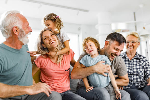 istock Playful multi-generation family having fun at home. 1399161749
