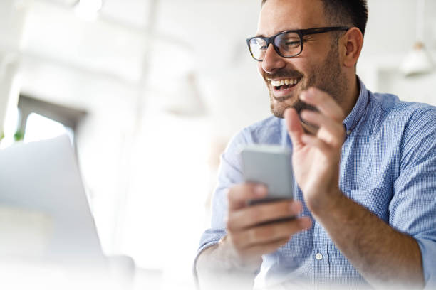istock Happy man waving while having a video call at home office. 1399161793