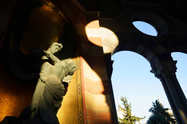Milan, Italy - November 28, 2021: Milan, Lombardy, Italy: historic cemetery known as Cimitero Monumentale: a statue