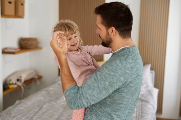 istock Father playing with a little daughter at home 1399162147