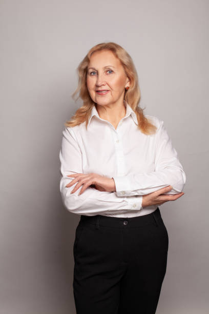 istock Middle age beautiful businesswoman standing over white background 1399164532