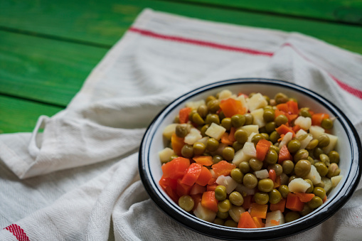 Mixed vegetables in a white dish.