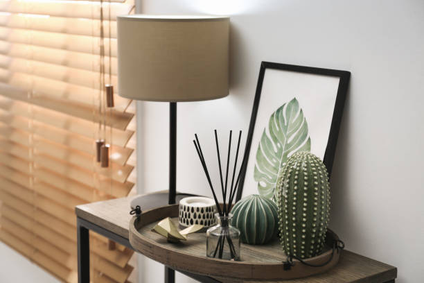 istock Wooden tray with decorations and lamp on table indoors 1399167658