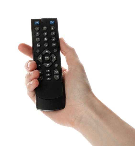 istock Woman holding remote control on white background, closeup 1399169343