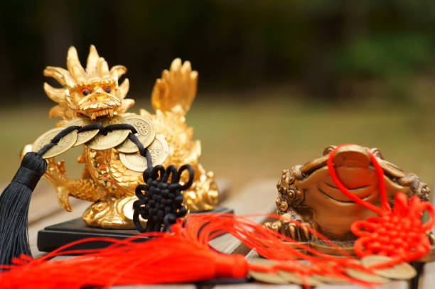 istock A dragon figurine with Chinese coins in its teeth. 1399169594