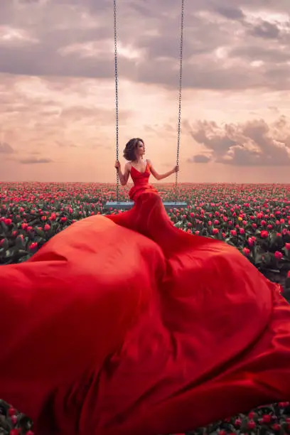 Photo of Beautiful woman in tulips field
