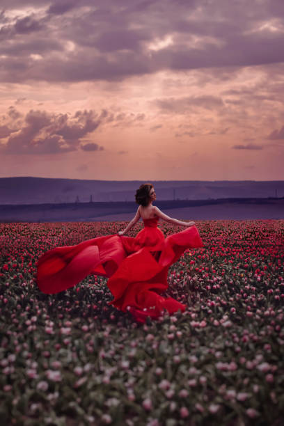 istock Beautiful woman in tulips field 1399171270