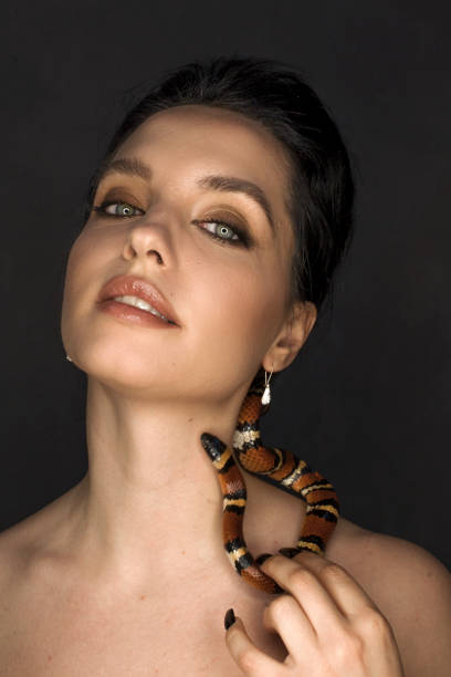 istock Beautiful woman as Gorgon with corn snake 1399172662