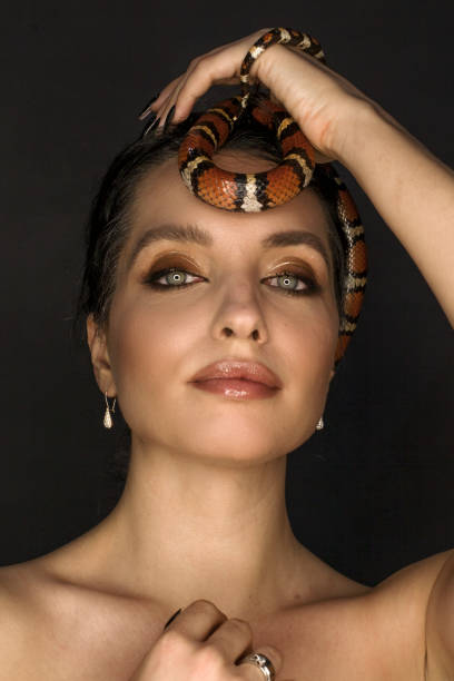 istock Beautiful woman as Gorgon with corn snake 1399173417