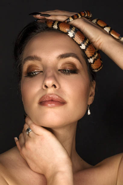 istock Beautiful woman as Gorgon with corn snake 1399173452
