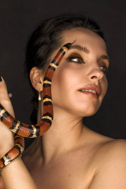 istock Beautiful woman as Gorgon with corn snake 1399173595