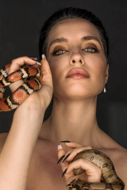 istock Beautiful woman as Gorgon with corn snake 1399173693