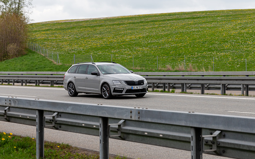 Kempten, Allgäu, Schwaben, Bavaria, Germany, may 1st 2022, a gray German Skoda facelifted 3rd generation Octavia RS station wagon approaching on the German A7 Autobahn at Kempten - with a length of 963 km between the borders of Denmark in the north and Austria in the south, the Autobahn 7 is the longest Autobahn in Germany - the majority of the German Autobahn does not have a mandatory but only an advisory speed limit