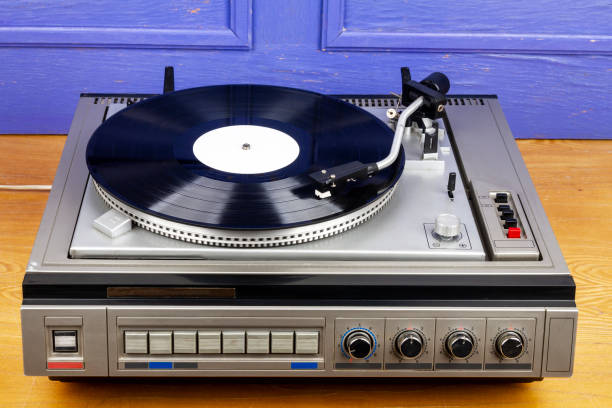 istock Vintage turntable vinyl record player with black vinyl 1399175558