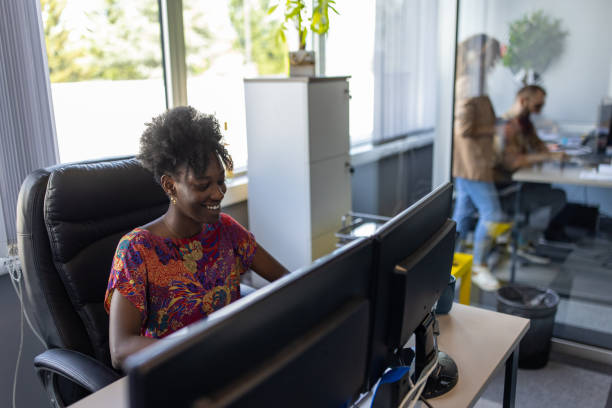 istock businesswoman Black ethnicity working in the office on computer 1399175874