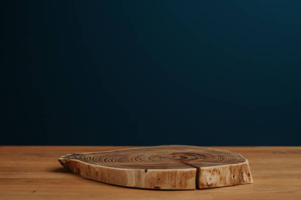 istock Wooden natural desk and dark blue background with copy space; 1399176557