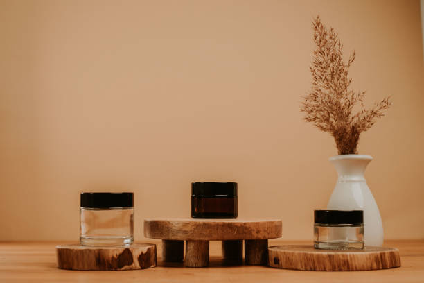 istock Jar set on wooden stage and brown natural leaf in vase 1399176579