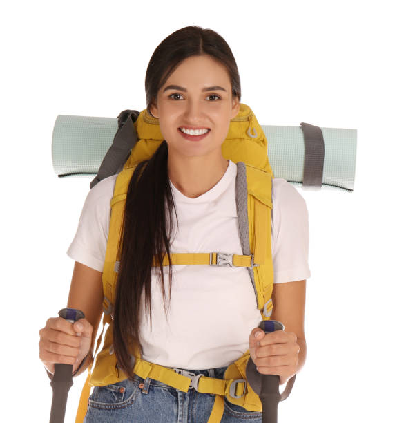 istock Female hiker with backpack and trekking poles on white background 1399176834