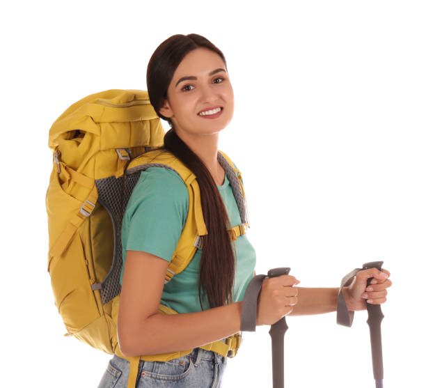 istock Female hiker with backpack and trekking poles on white background 1399176842