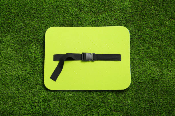 istock Bright foam seat mat for tourist on green grass, top view 1399177202