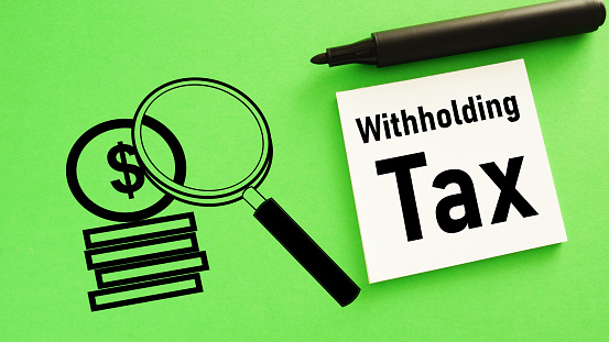 Withholding Tax is shown using a text