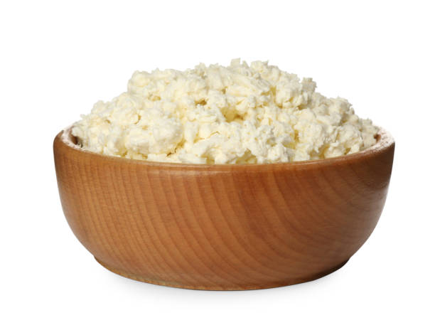 istock Delicious fresh cottage cheese in bowl isolated on white 1399179159