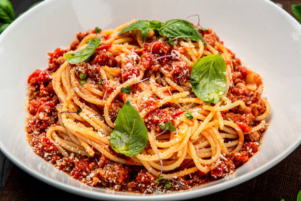 istock Traditional italian spaghetti bolognese on a dark background 1399179377